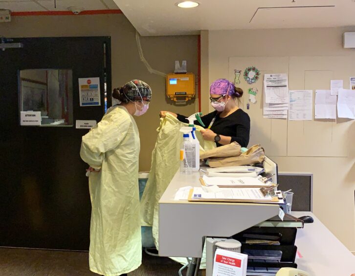 Photo of two nurses working.