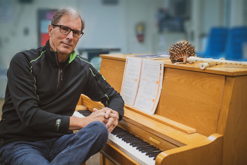 Photo of Steve Erickson sitting at a piano.